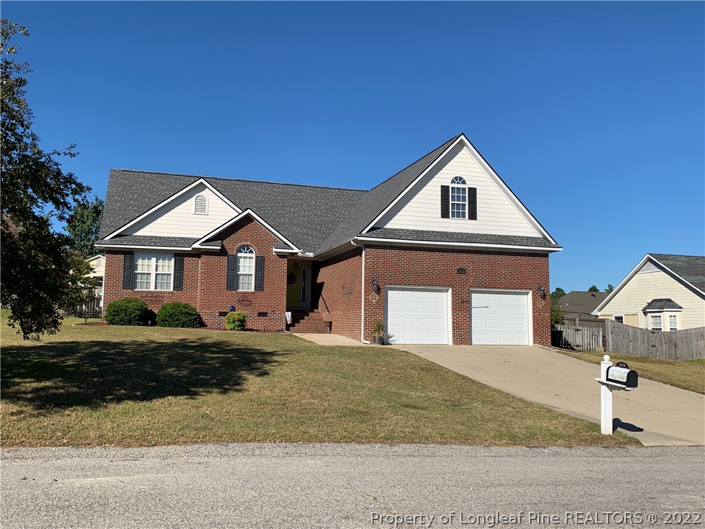 5428 Arnette Road Hope Mills, NC 28348 - Photo 1 of 41 a front view of a house with a yard