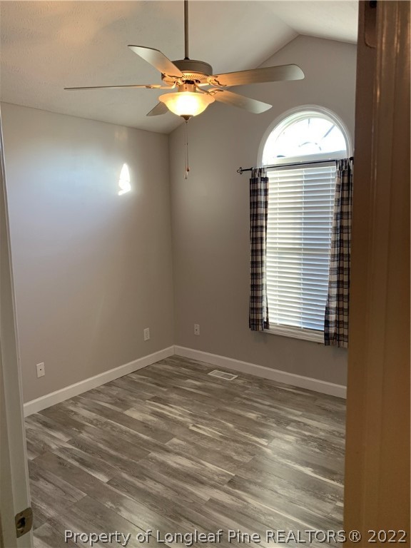 5428 Arnette Road Hope Mills, NC 28348 - Photo 13 of 41 a view of a livingroom with a chandelier