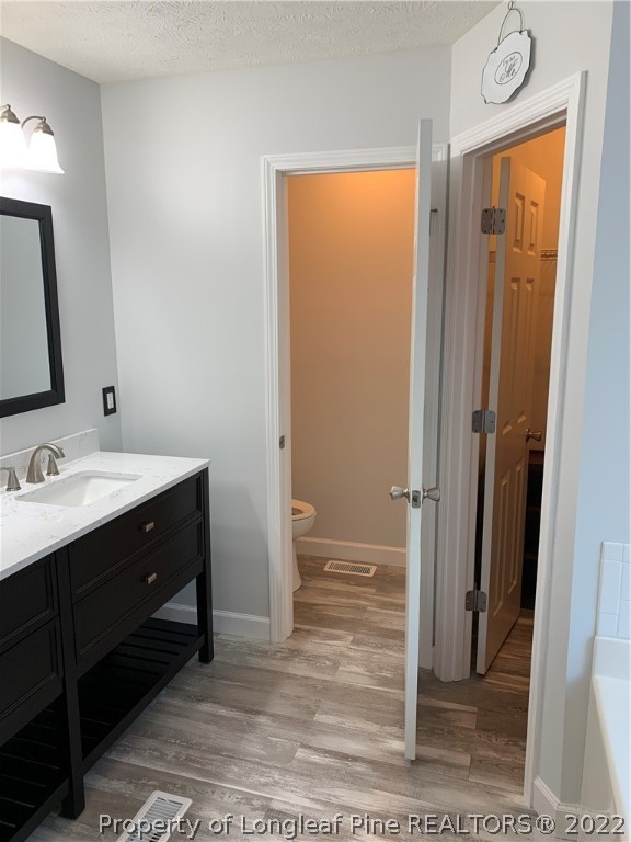 5428 Arnette Road Hope Mills, NC 28348 - Photo 14 of 41 a bathroom with a sink a mirror and a shower