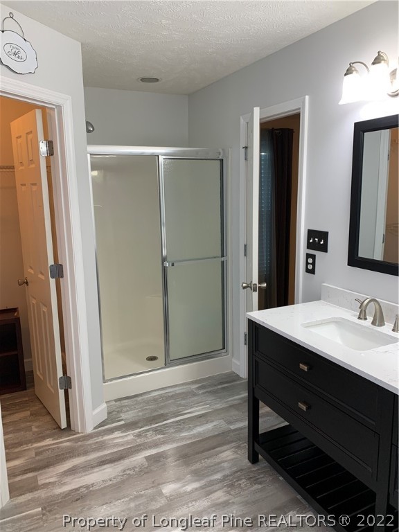 5428 Arnette Road Hope Mills, NC 28348 - Photo 18 of 41 a bathroom with a sink a mirror and a shower