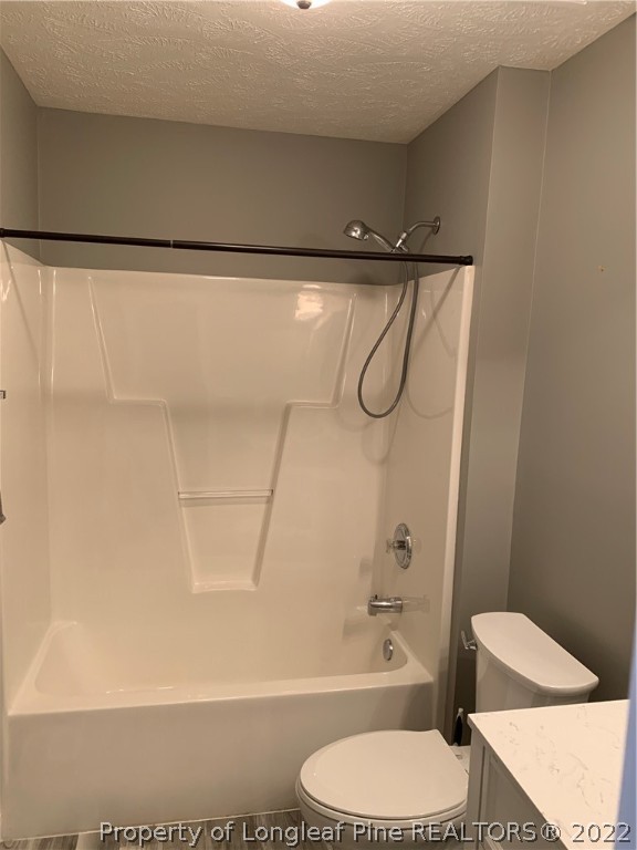5428 Arnette Road Hope Mills, NC 28348 - Photo 20 of 41 a bathroom with a toilet and a bathtub