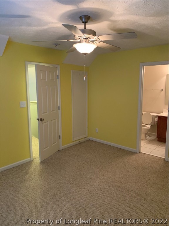5428 Arnette Road Hope Mills, NC 28348 - Photo 37 of 41 a view of a livingroom with a chandelier fan and a bathroom