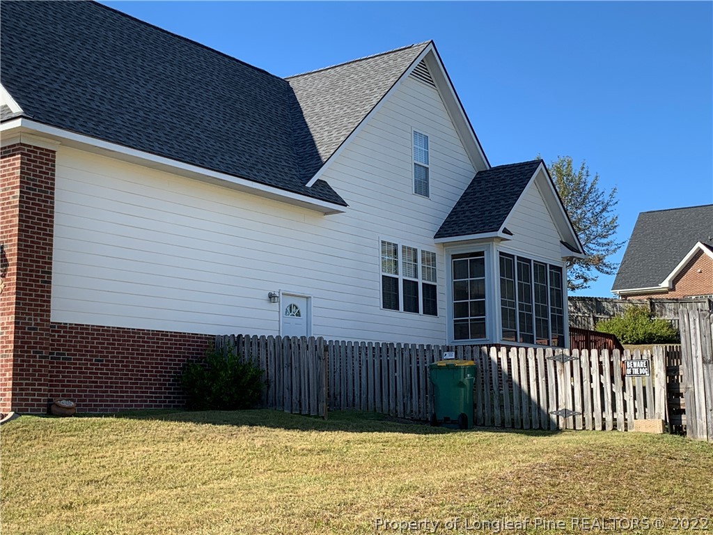 5428 Arnette Road Hope Mills, NC 28348 - Photo 4 of 41 a view of a house with wooden fence