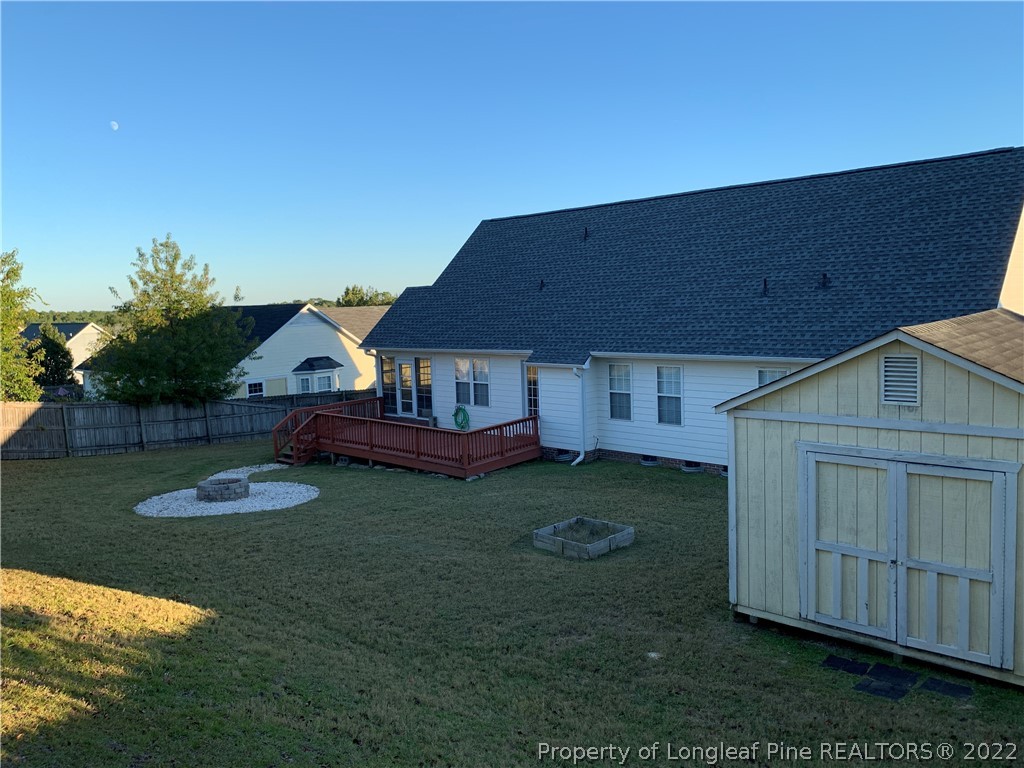 5428 Arnette Road Hope Mills, NC 28348 - Photo 5 of 41 a view of a house with backyard and garden