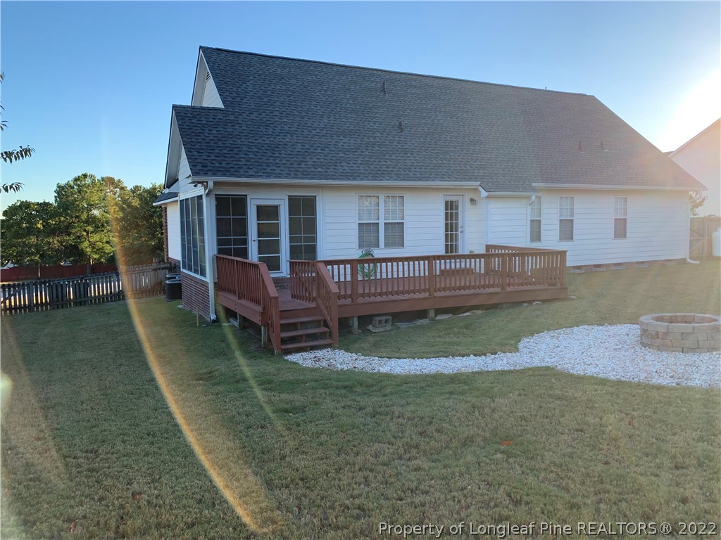 5428 Arnette Road Hope Mills, NC 28348 - Photo 6 of 41 a view of a house with a yard