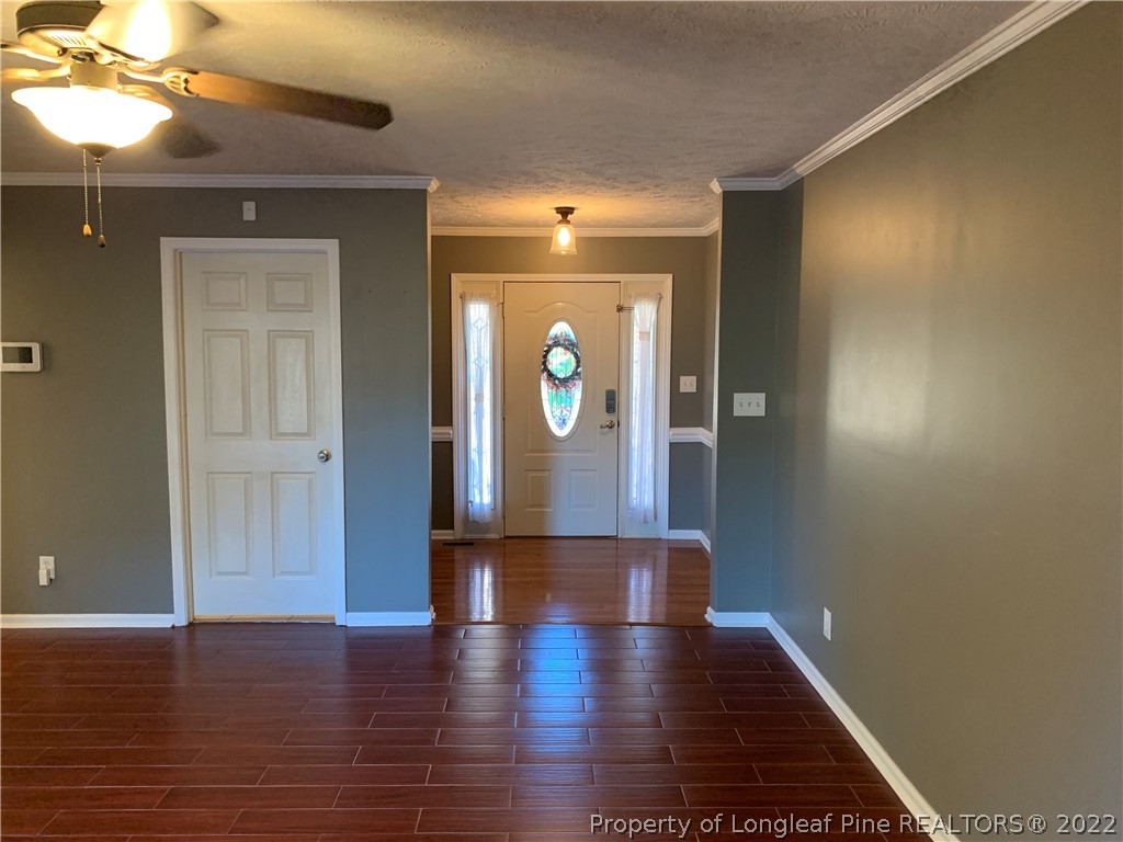 5428 Arnette Road Hope Mills, NC 28348 - Photo 8 of 41 a view of hallway with wooden floor