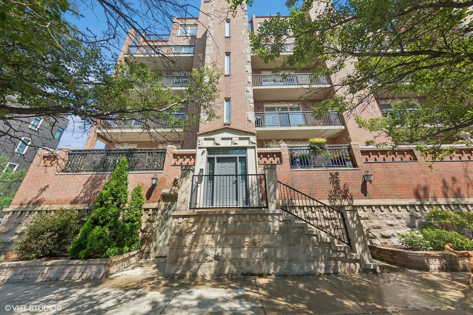 820 West Hubbard Street, Unit 4 Chicago, IL 60642 - Photo 1 of 28 front view of a building with a garden