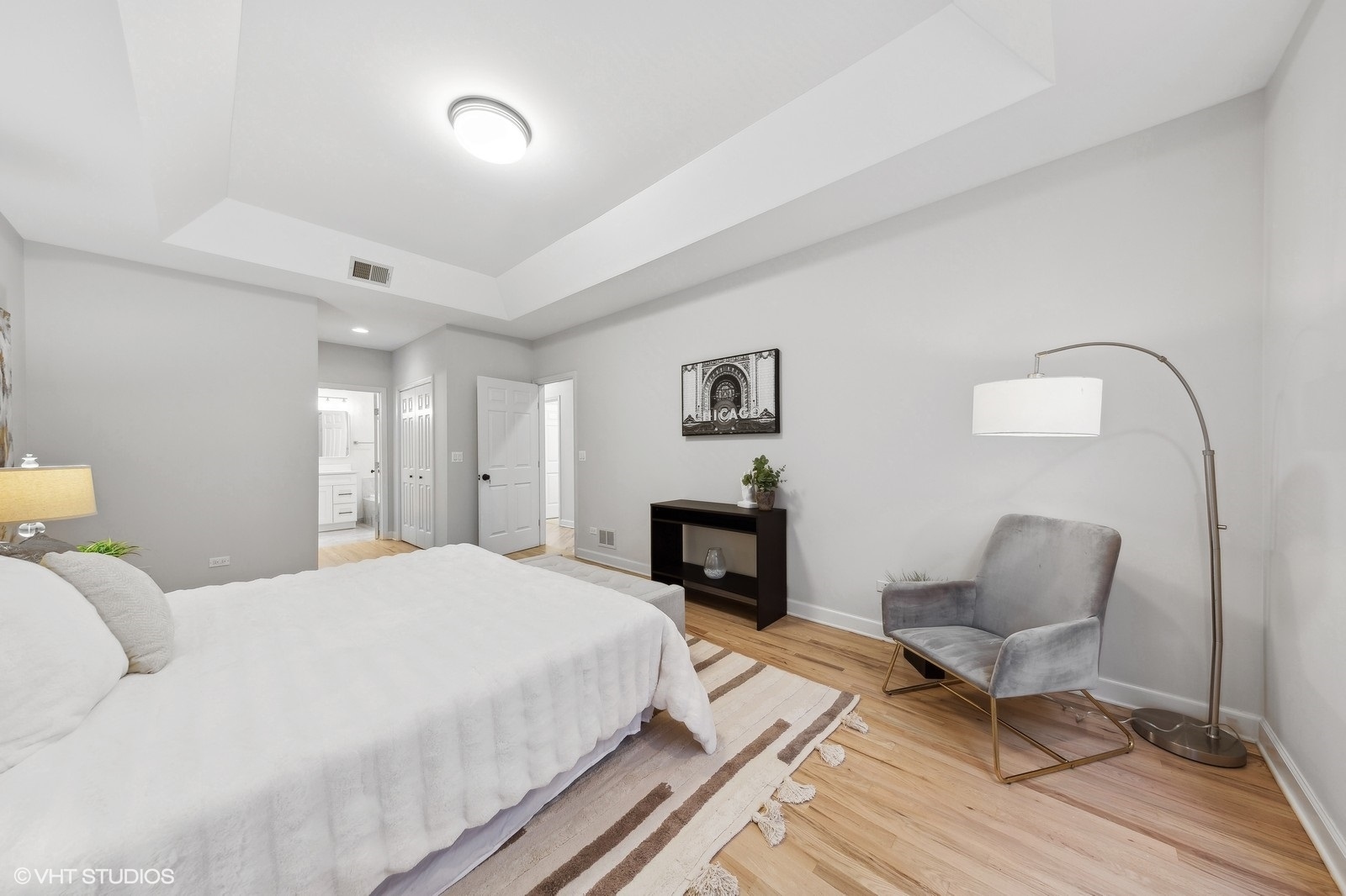 820 West Hubbard Street, Unit 4 Chicago, IL 60642 - Photo 16 of 28 a bedroom with a bed and a chair