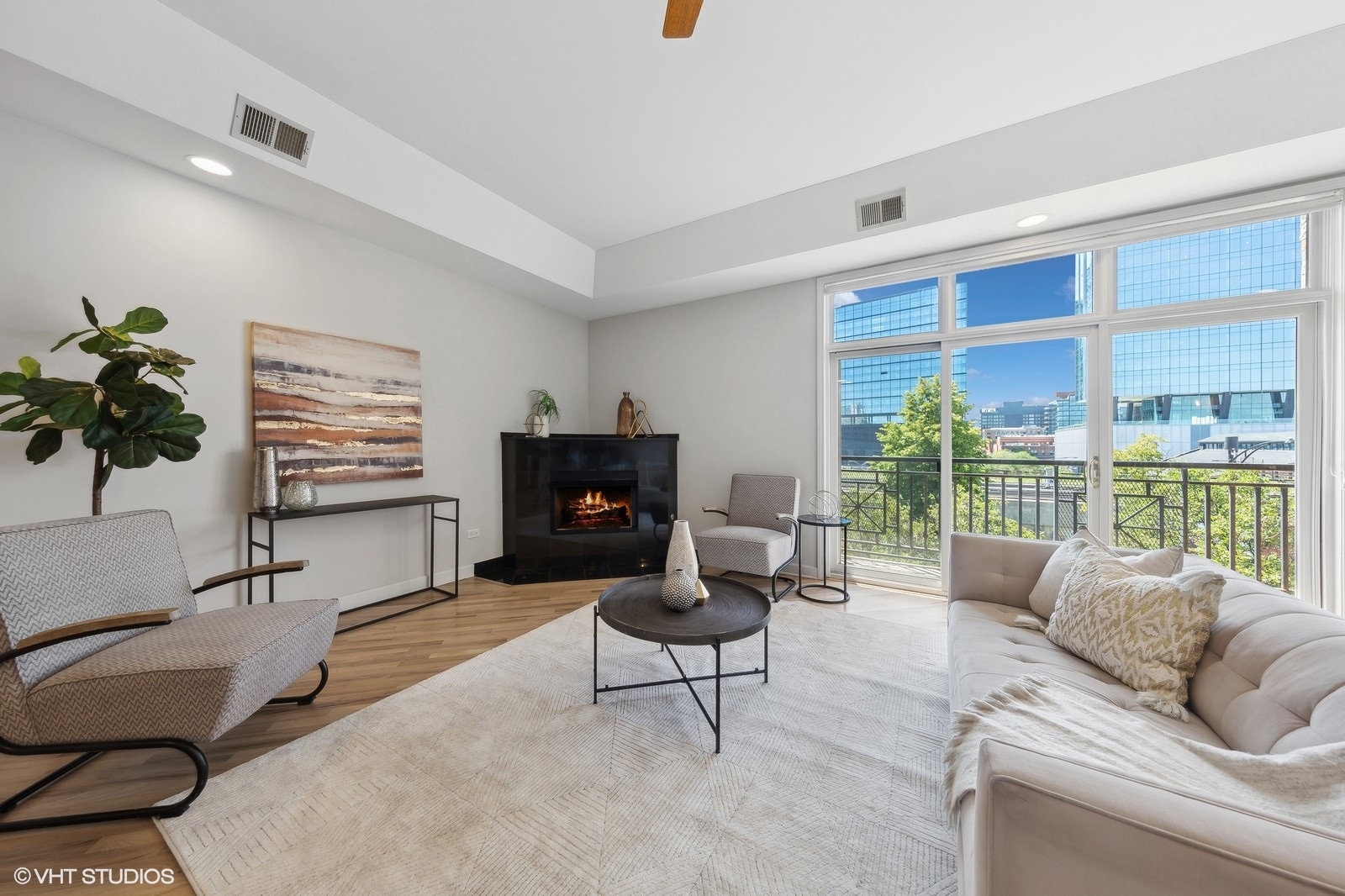 820 West Hubbard Street, Unit 4 Chicago, IL 60642 - Photo 7 of 28 a living room with furniture a large window and a flat screen tv