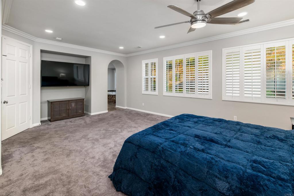 1459 Lighthouse Road San Marcos, CA 92078 - Photo 23 of 50 a bed sitting in a spacious bedroom next to a window and a television