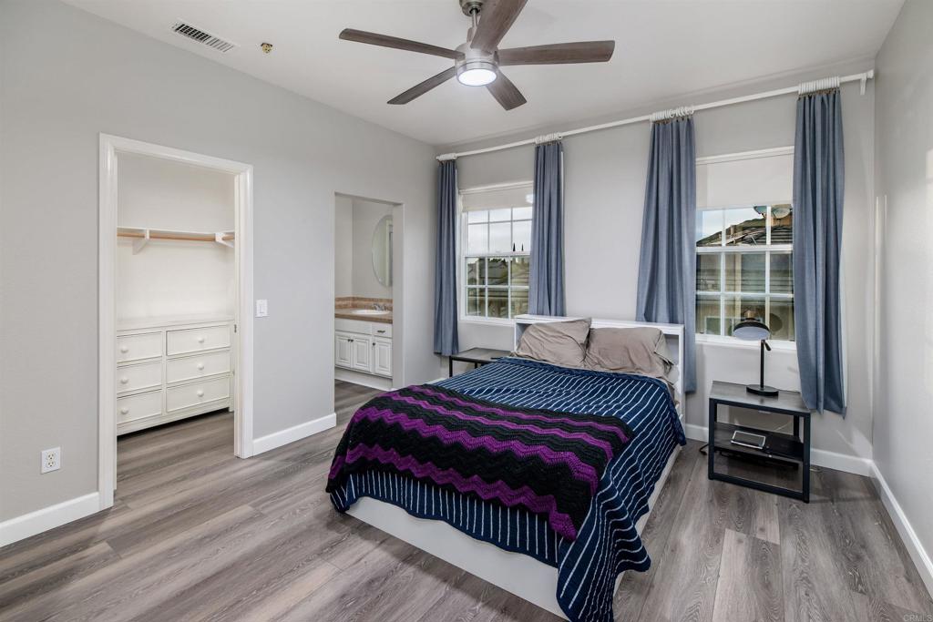 1459 Lighthouse Road San Marcos, CA 92078 - Photo 27 of 50 a bedroom with a bed and wooden floor