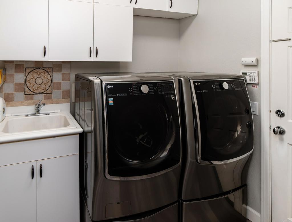 1459 Lighthouse Road San Marcos, CA 92078 - Photo 32 of 50 a bathroom with a sink and mirror