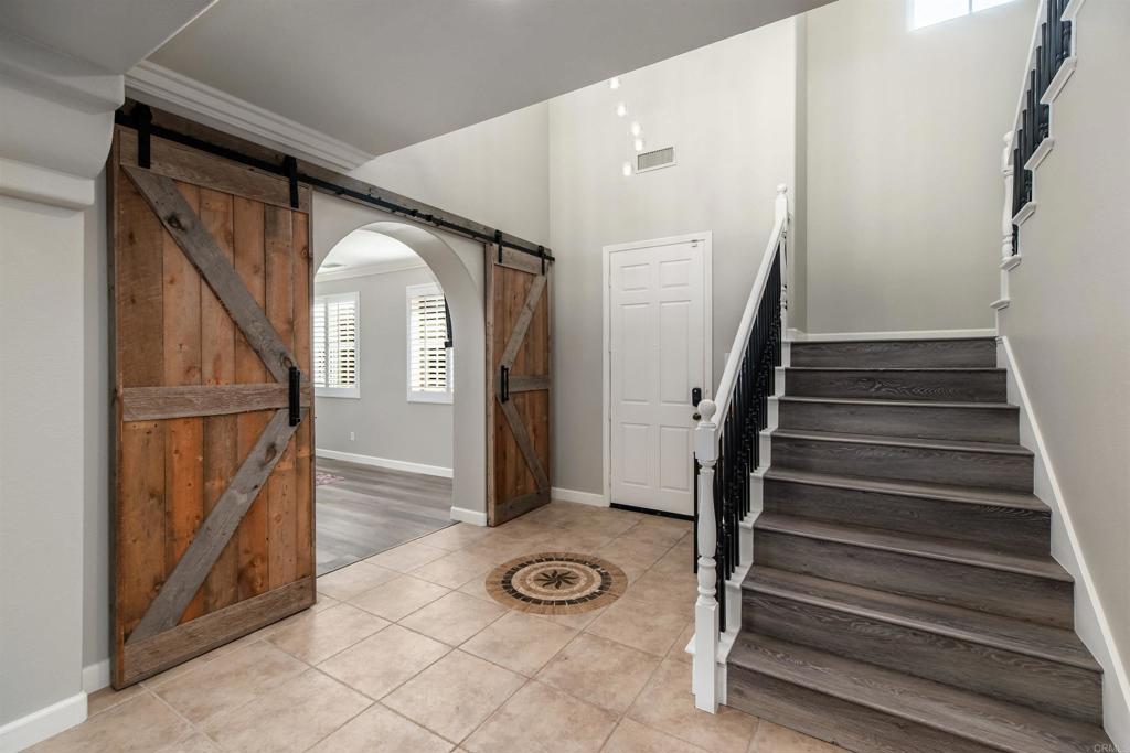 1459 Lighthouse Road San Marcos, CA 92078 - Photo 8 of 50 a view of entryway with wooden floor and a front door