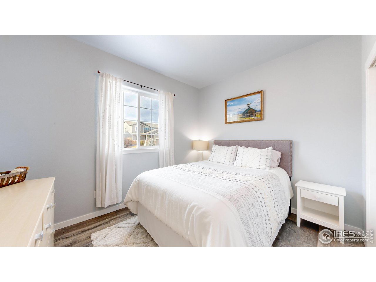 511 Wind River Drive Windsor, CO 80550 - Photo 12 of 22 a room with a bed and a window