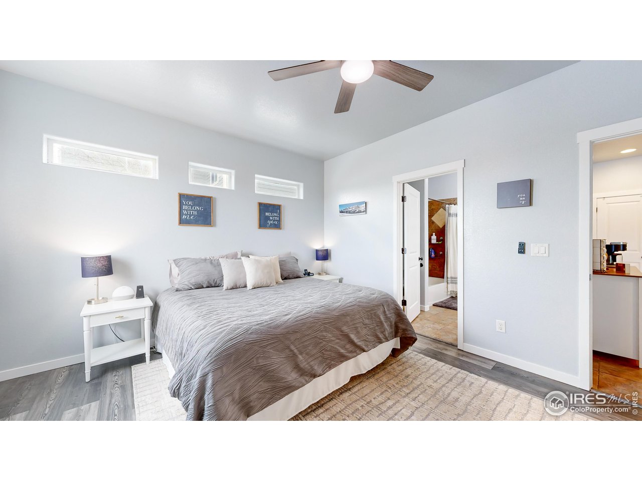 511 Wind River Drive Windsor, CO 80550 - Photo 13 of 22 a room with a bed and a cabinets