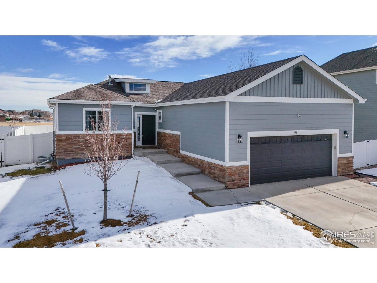 511 Wind River Drive Windsor, CO 80550 - Photo 2 of 22 a view of a house with a yard