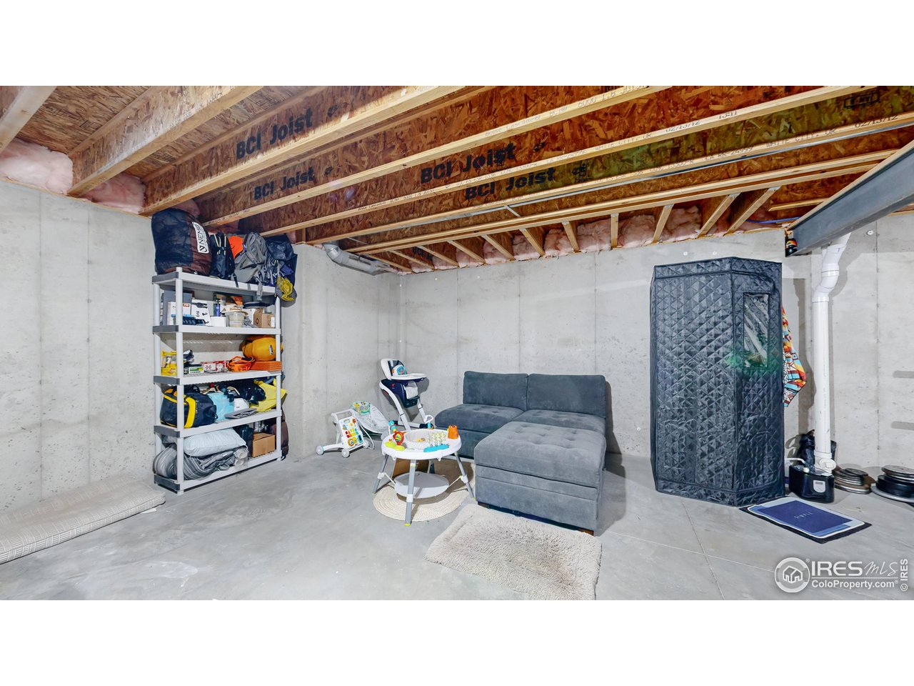 511 Wind River Drive Windsor, CO 80550 - Photo 22 of 22 a black and white photo of a living room