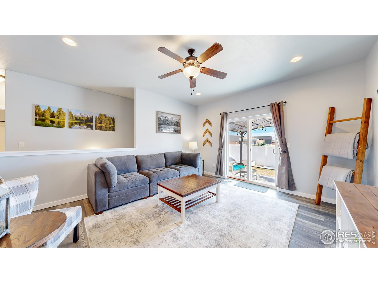 511 Wind River Drive Windsor, CO 80550 - Photo 3 of 22 a living room with furniture and a flat screen tv