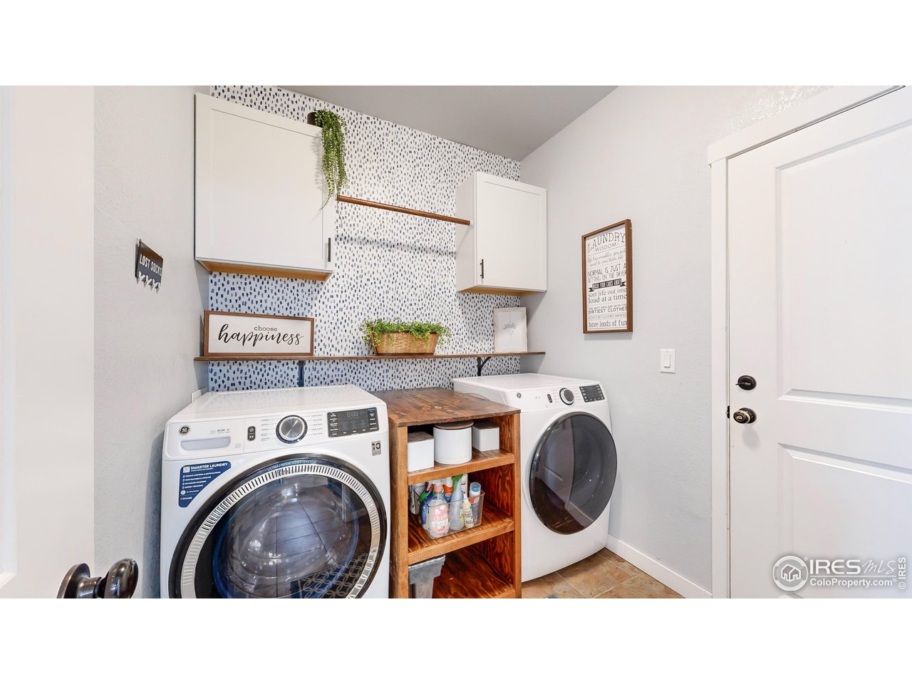 511 Wind River Drive Windsor, CO 80550 - Photo 8 of 22 a utility room with dryer and washer
