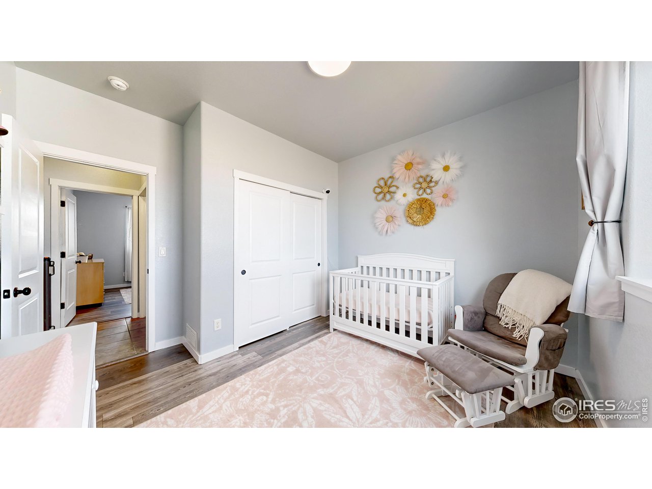 511 Wind River Drive Windsor, CO 80550 - Photo 10 of 22 a living room with furniture and a window