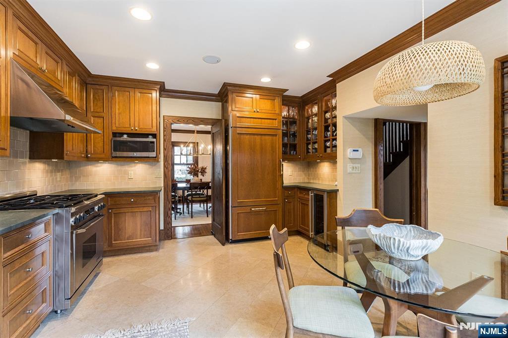 13 Ferncliff Terrace Glen Ridge, NJ 07028 - Photo 17 of 49 a kitchen with stainless steel appliances granite countertop a stove refrigerator and cabinets