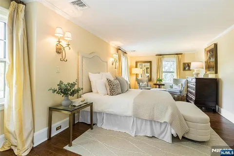 a bed room with a bed and a chandelier