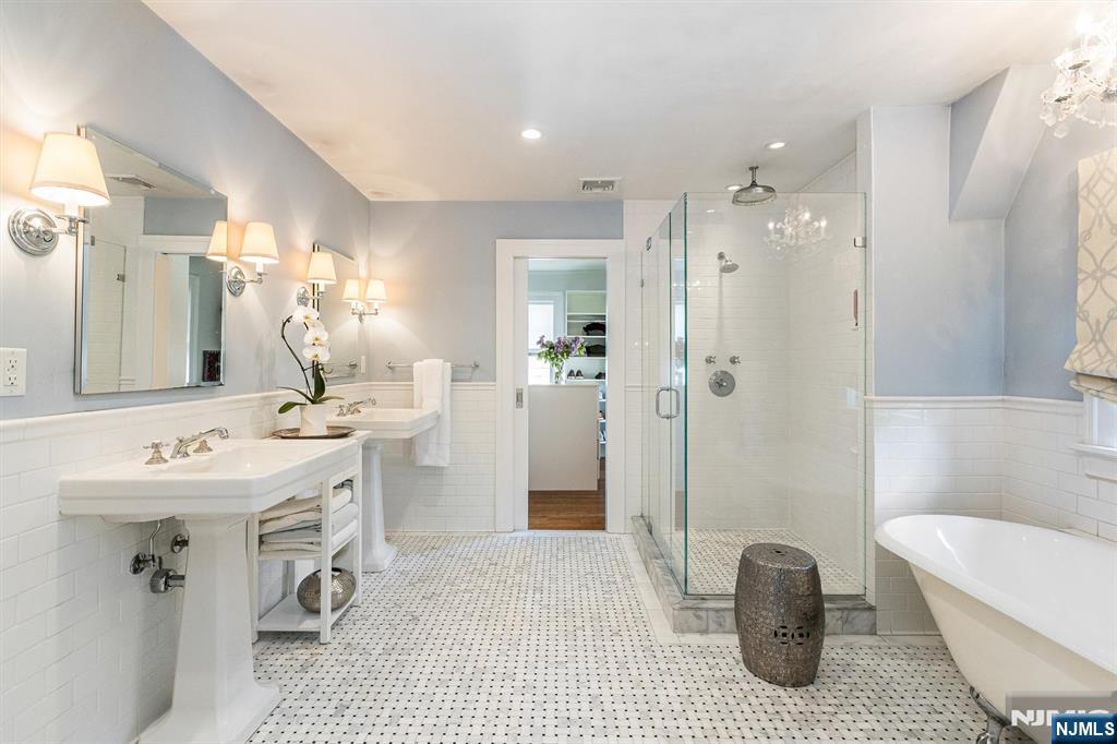 13 Ferncliff Terrace Glen Ridge, NJ 07028 - Photo 24 of 49 a bathroom with a sink a toilet a mirror and shower
