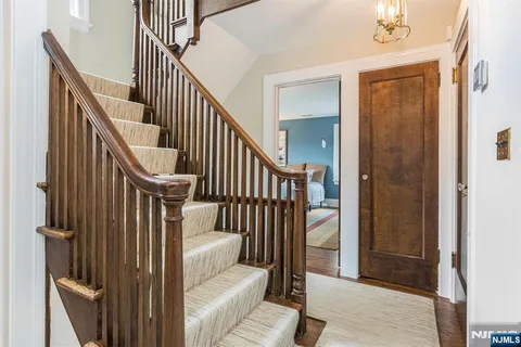 a view of entryway with wooden floor and door