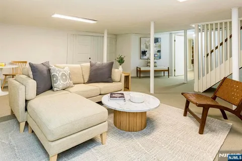 a living room with furniture and a table