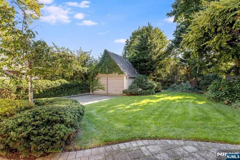 a view of a backyard with large trees