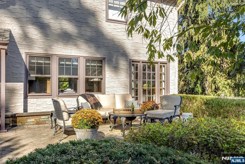 13 Ferncliff Terrace Glen Ridge, NJ 07028 - Photo 41 of 49 a view of a patio with table and chairs and potted plants