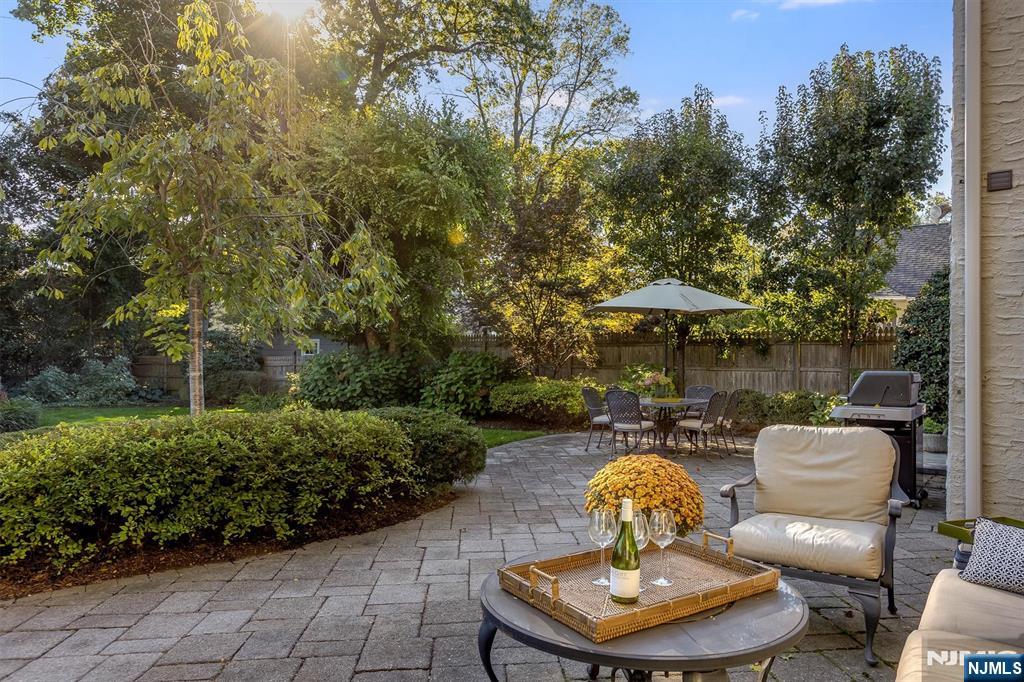 13 Ferncliff Terrace Glen Ridge, NJ 07028 - Photo 42 of 49 a backyard of a house with table and chairs