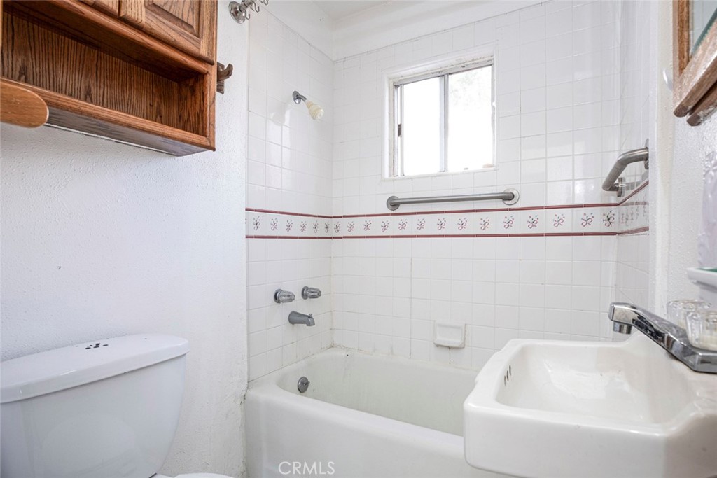 3704 3rd Avenue La Crescenta, CA 91214 - Photo 11 of 22 a bathroom with a tub a sink and a toilet
