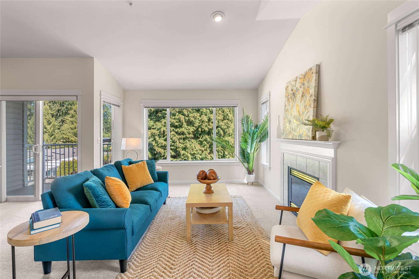 2009 196th Street Southeast, Unit E304 Bothell, WA 98012 - Photo 1 of 36 a living room with furniture and a fireplace