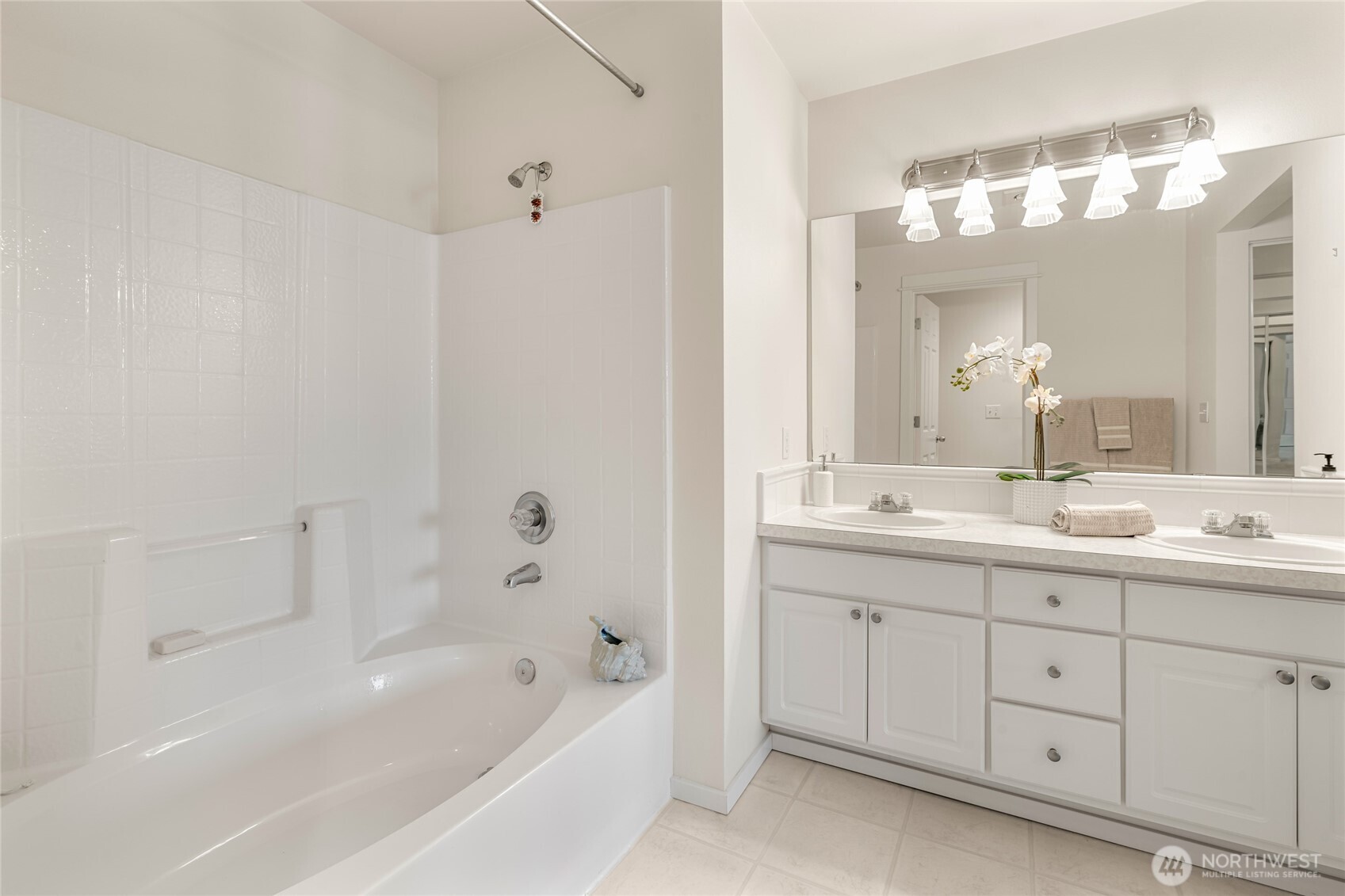 2009 196th Street Southeast, Unit E304 Bothell, WA 98012 - Photo 11 of 36 a bathroom with a tub a sink double and mirror
