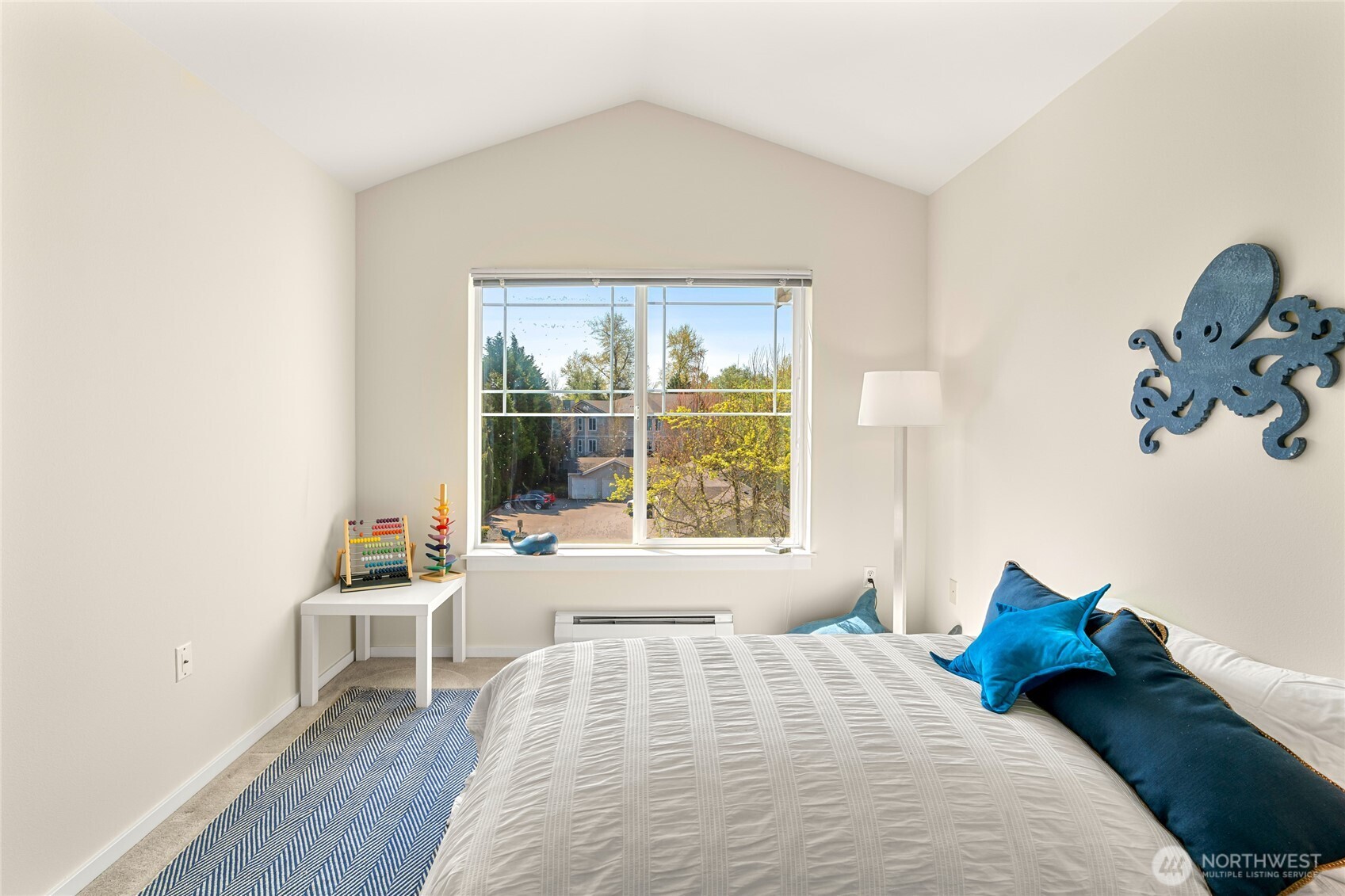 2009 196th Street Southeast, Unit E304 Bothell, WA 98012 - Photo 18 of 36 a bedroom with a bed and a large window