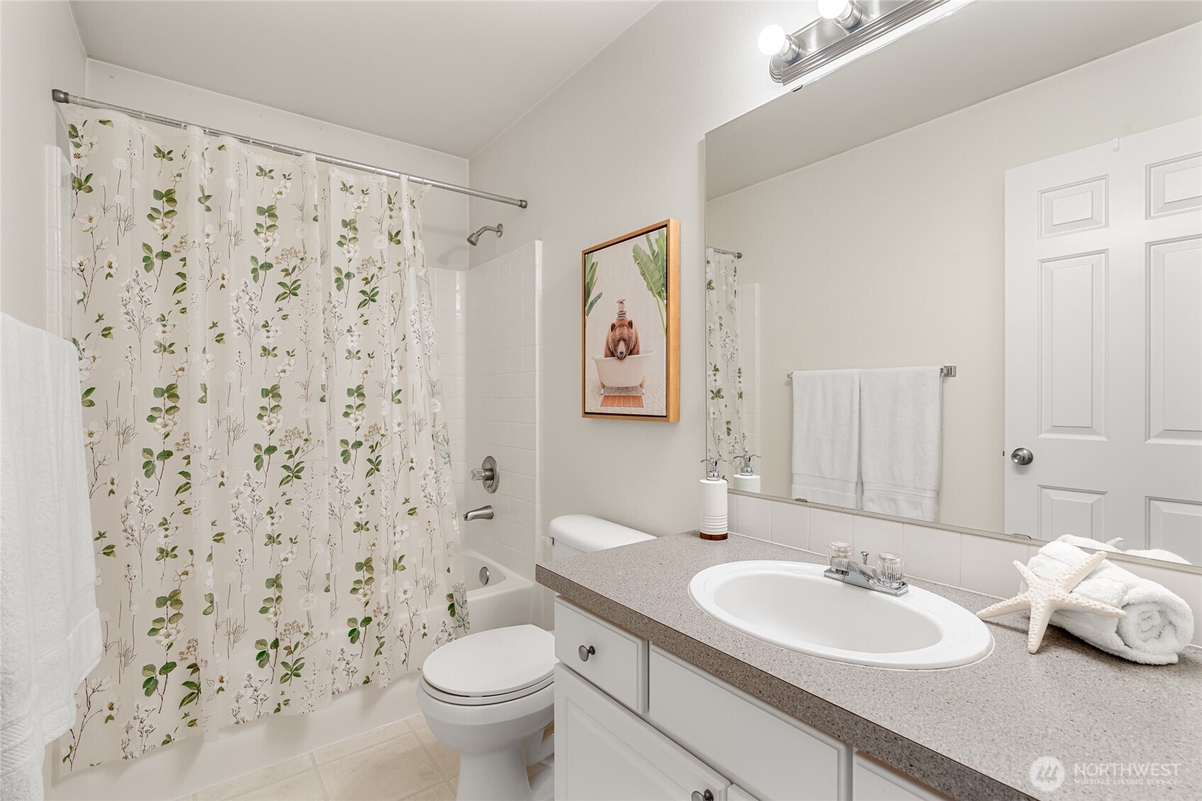 2009 196th Street Southeast, Unit E304 Bothell, WA 98012 - Photo 19 of 36 a bathroom with a sink toilet and a mirror
