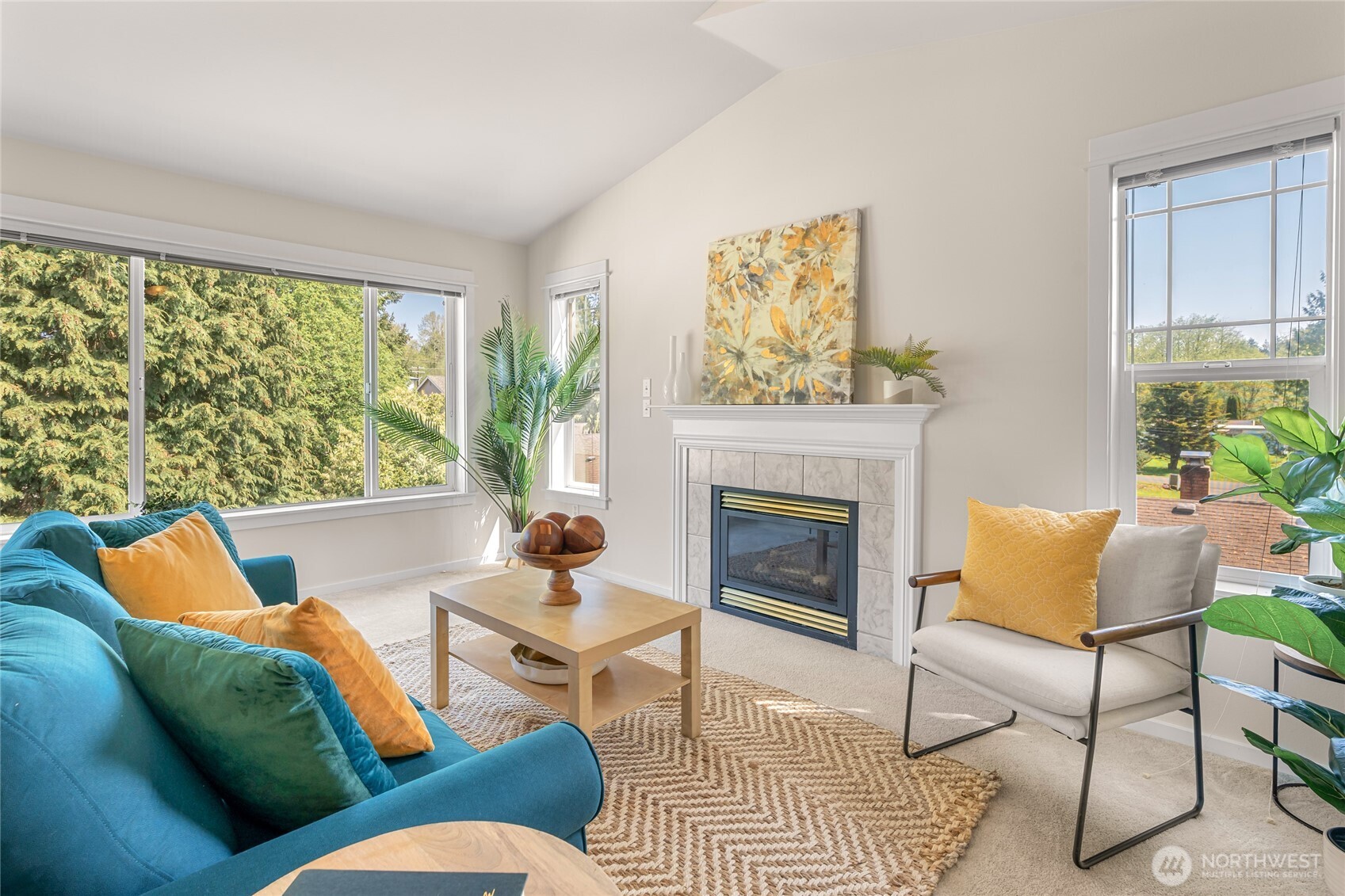 2009 196th Street Southeast, Unit E304 Bothell, WA 98012 - Photo 2 of 36 a living room with furniture and a fireplace