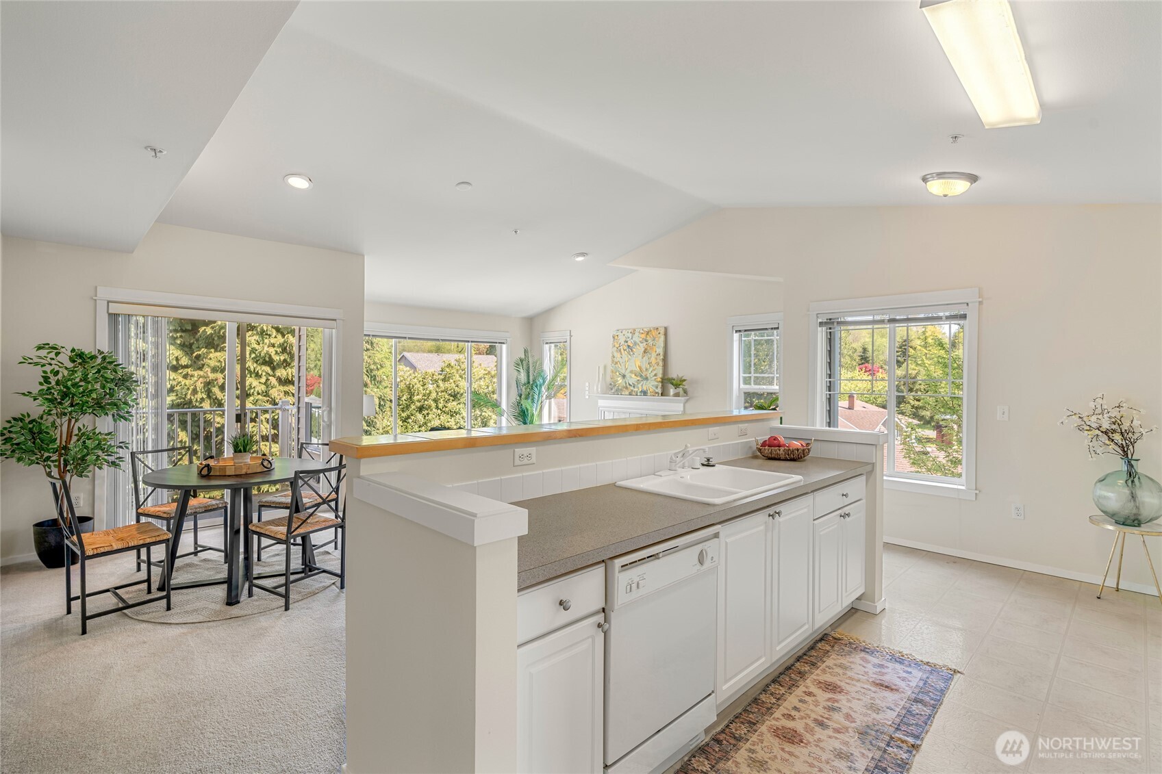 2009 196th Street Southeast, Unit E304 Bothell, WA 98012 - Photo 21 of 36 a kitchen that has a sink and a large window