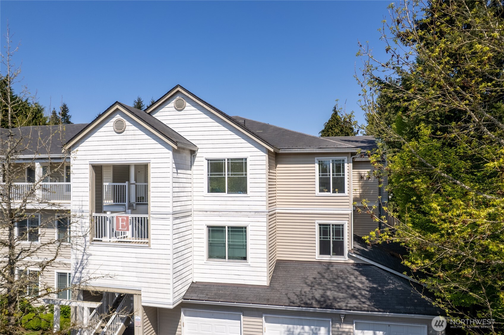 2009 196th Street Southeast, Unit E304 Bothell, WA 98012 - Photo 26 of 36 a front view of a house with garden