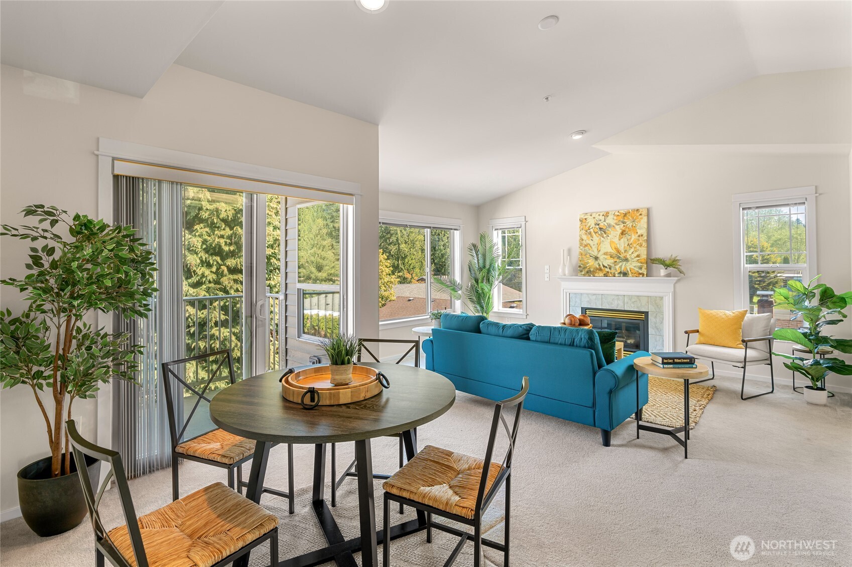 2009 196th Street Southeast, Unit E304 Bothell, WA 98012 - Photo 4 of 36 a living room with furniture a fireplace and a potted plant