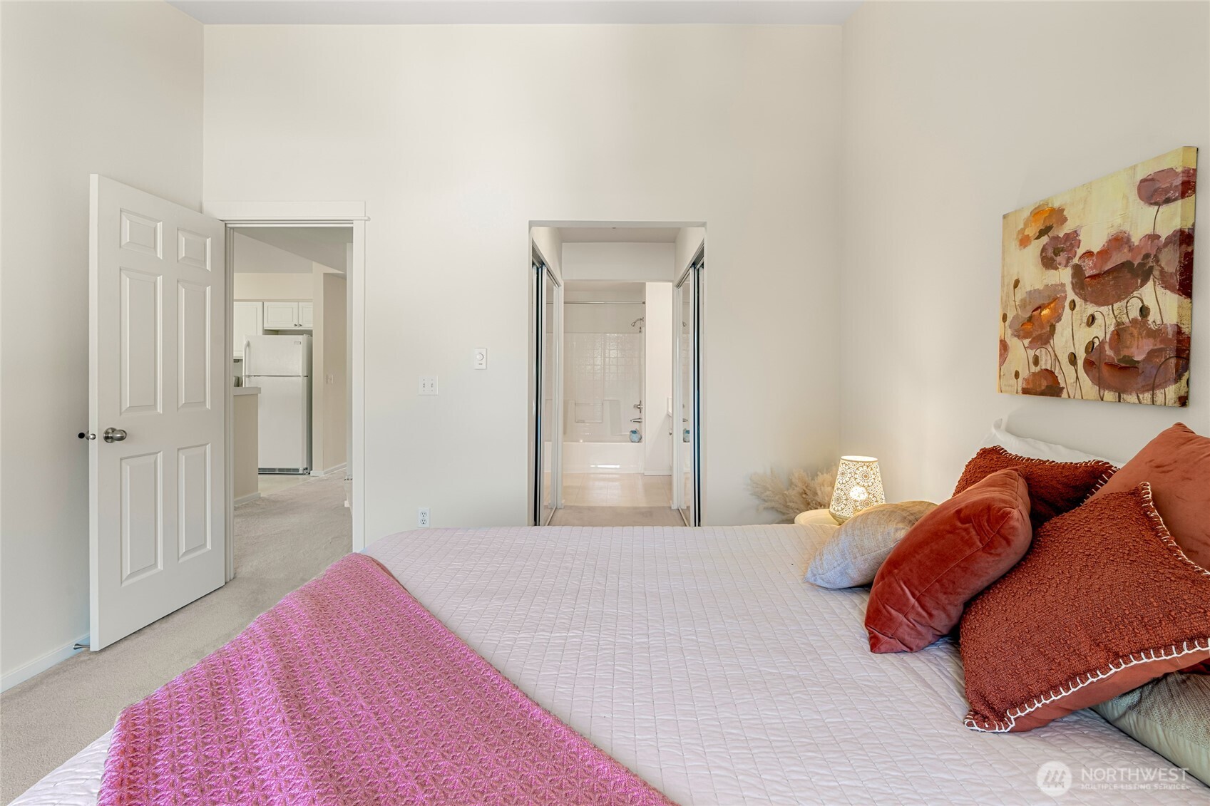 2009 196th Street Southeast, Unit E304 Bothell, WA 98012 - Photo 8 of 36 a bedroom with a bed and a painting on the wall