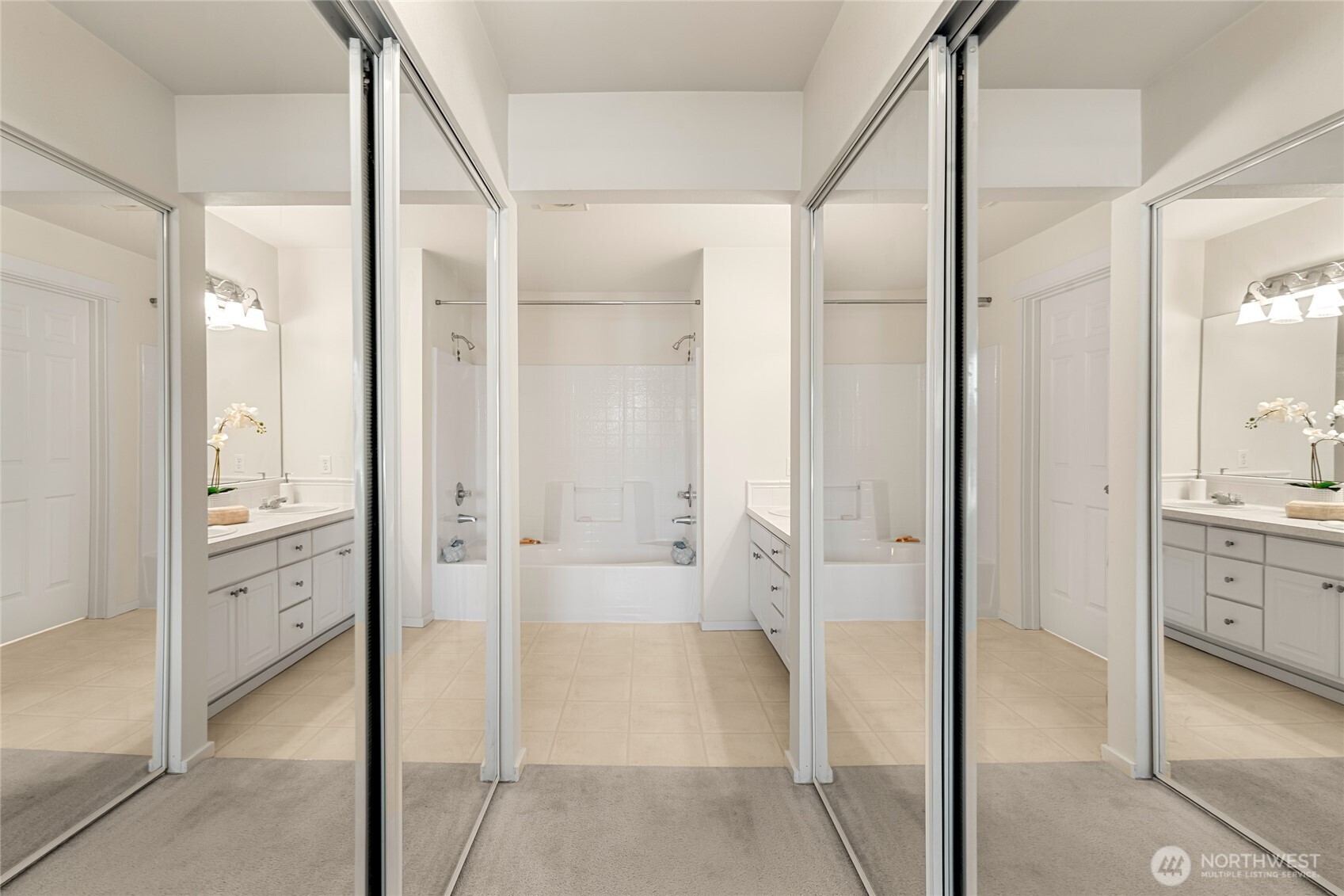 2009 196th Street Southeast, Unit E304 Bothell, WA 98012 - Photo 9 of 36 a bathroom with a granite countertop shower mirror and a sink