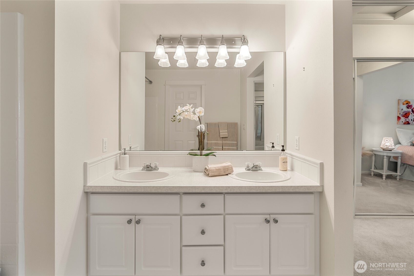2009 196th Street Southeast, Unit E304 Bothell, WA 98012 - Photo 10 of 36 a bathroom with a double vanity sink and a mirror