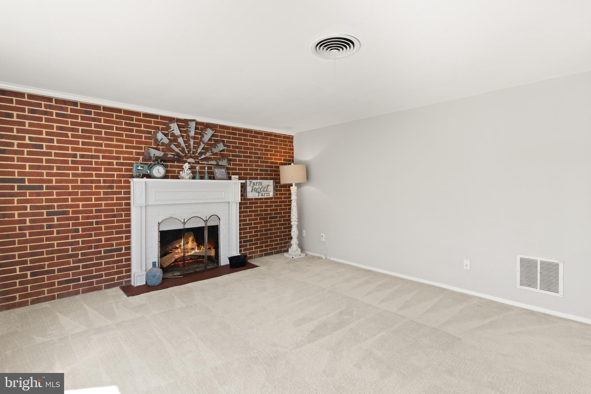 7516 Essex Avenue Springfield, VA 22150 - Photo 2 of 36 a view of empty room with a fireplace