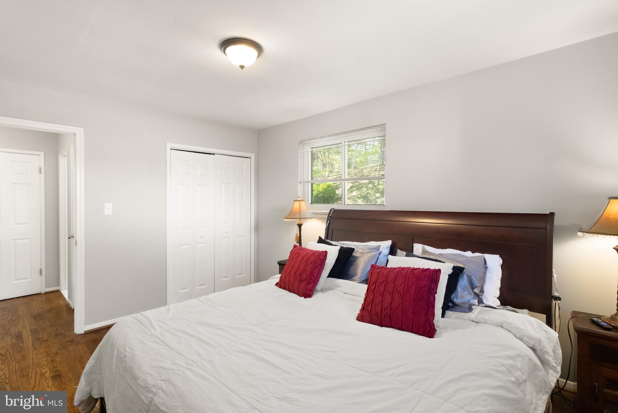7516 Essex Avenue Springfield, VA 22150 - Photo 21 of 36 a bedroom with a large bed and a window