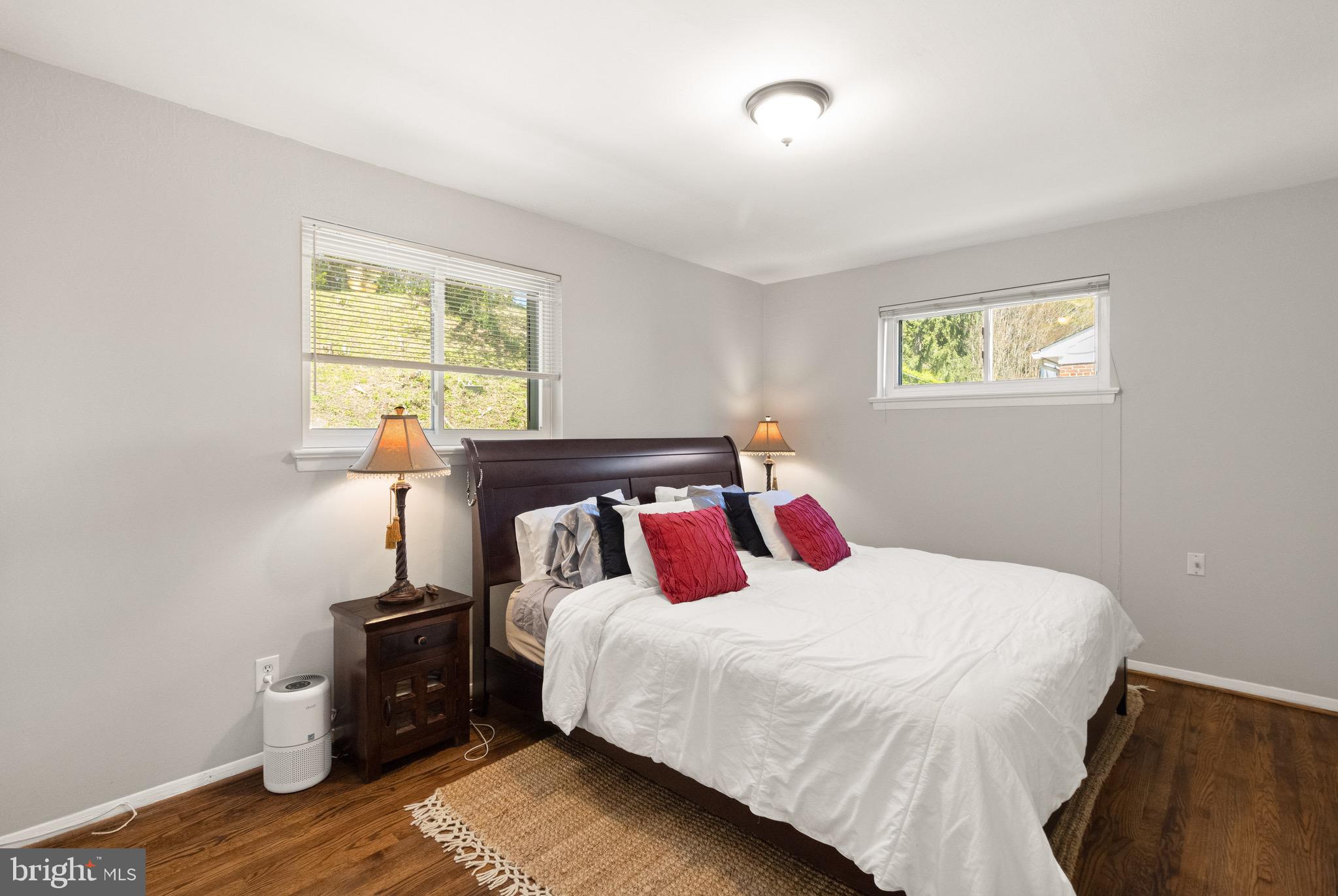 7516 Essex Avenue Springfield, VA 22150 - Photo 22 of 36 a bedroom with a bed and wooden floor