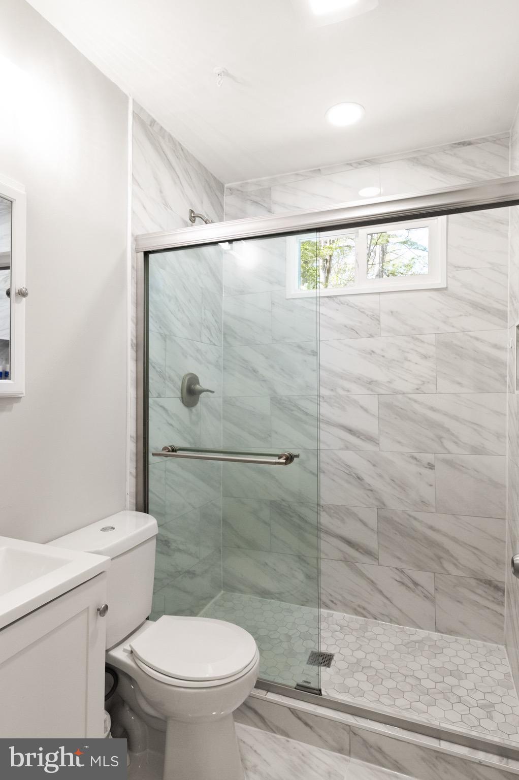 7516 Essex Avenue Springfield, VA 22150 - Photo 25 of 36 a bathroom with a shower and a toilet