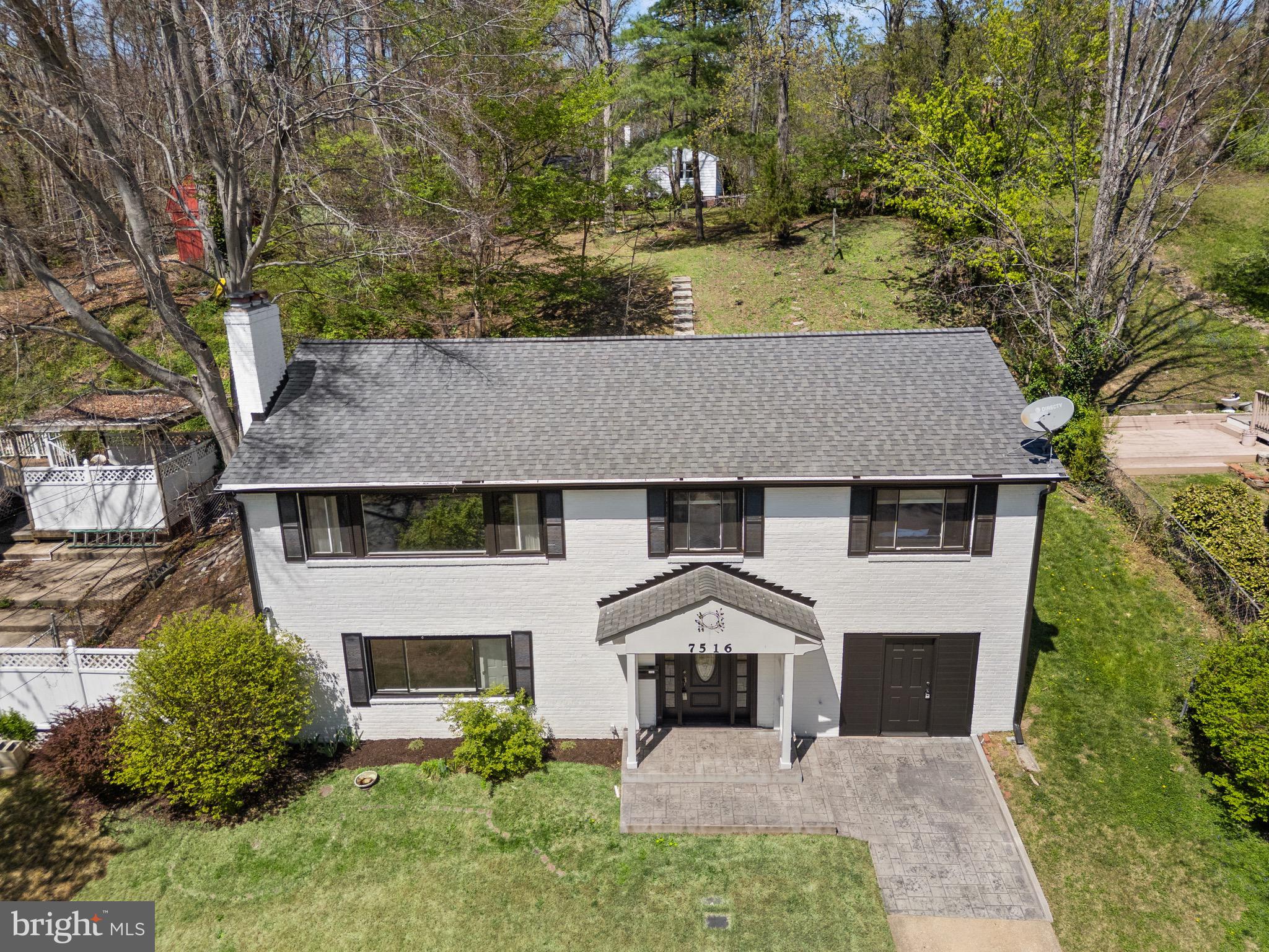 7516 Essex Avenue Springfield, VA 22150 - Photo 33 of 36 front view of a house with a yard