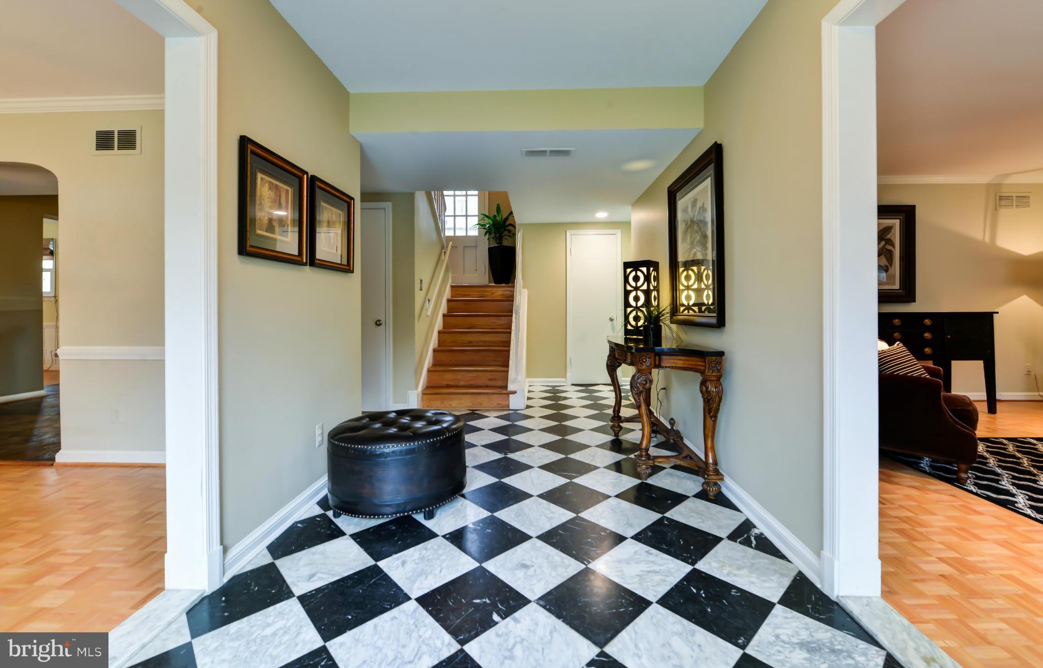 7303 Fort Hunt Road Alexandria, VA 22307 - Photo 12 of 30 a view of a hallway with a black and white checkered floor